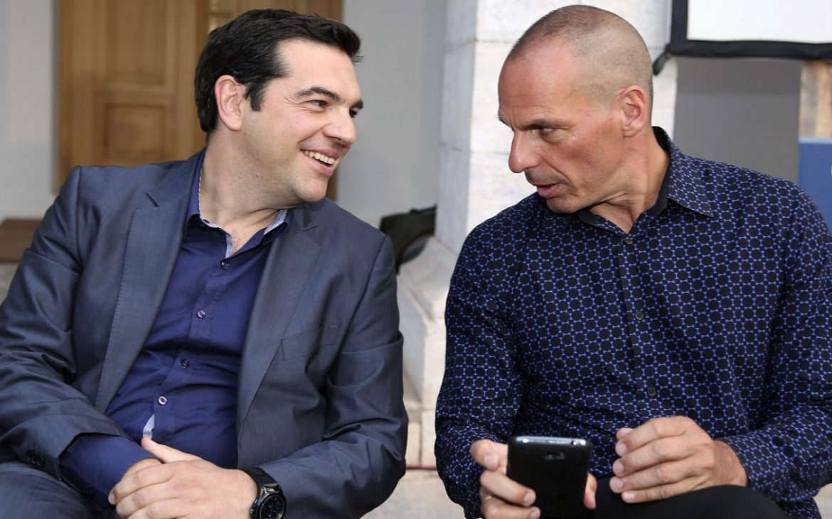 In this Monday, June 16, 2014 photo Greece's new Prime Minister Alexis Tsipras, left, attends a book presentation of Yanis Varoufakis, right, in Athens. Economist and outspoken bailout critic Yanis Varoufakis, 53, has confirmed on Tuesday, Jan. 27, 2015 in a blog post that he will be sworn in as Finance Minister under the country’s new left wing government. (AP Photo/InTime News, Giannis Liakos)  GREECE OUT
