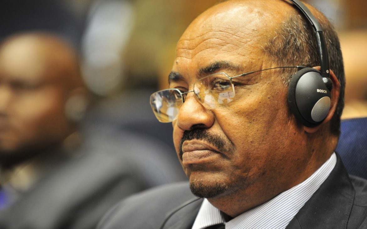 Omar Hassan Ahmad al-Bashir, president of Sudan, listens to translated remarks during the opening of the 20th session of The New Partership for Africa's Development (NEPAD)