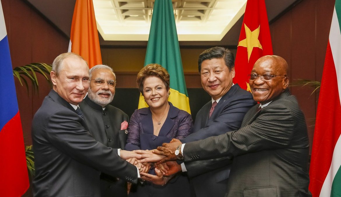 BRICS_heads_of_state_and_government_hold_hands_ahead_of_the_2014_G-20_summit_in_Brisbane_Australia_Agencia_Brasil-e1444050000840-1170x677.jpg