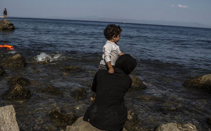 An Iraqi woman and her child look out over the sea between Greece and Turkey from the Greek island of Lesvos. Sept 4th, 2015 So far in 2015 more than 350,000 desperate people have made the perilous journey across the Mediterranean Sea. For those who do survive the treacherous journey, the terrifying ordeal is not over. Children often arrive in Europe scared and exhausted.Many have seen and experienced untold horrors during their journey.The physical impact of travelling is also clear. The children our teams have met have had severe sunburns and blisters from their journey. Many have lost their toenails from the huge distances they had walked. Save the Children has worked on these issues for decades and we work along the whole route that refugees take. We work in the countries they are fleeing â countries like Syria, where brutal war has ripped apart the lives of millions. We work in countries en route, like Turkey, Egypt, Greece and Italy â making sure children are protected wherever possible. We also work in countries like Germany, to ensure that that families understand their rights and have access to care and support.